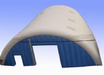 Large white and blue inflatable event tent with clear sky windows